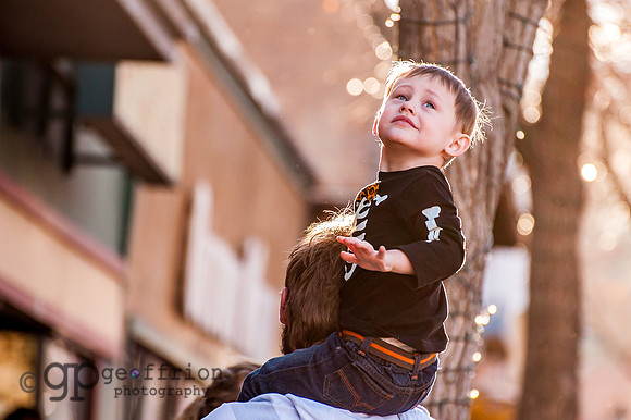 Boy Sitting on Father's Shoulders